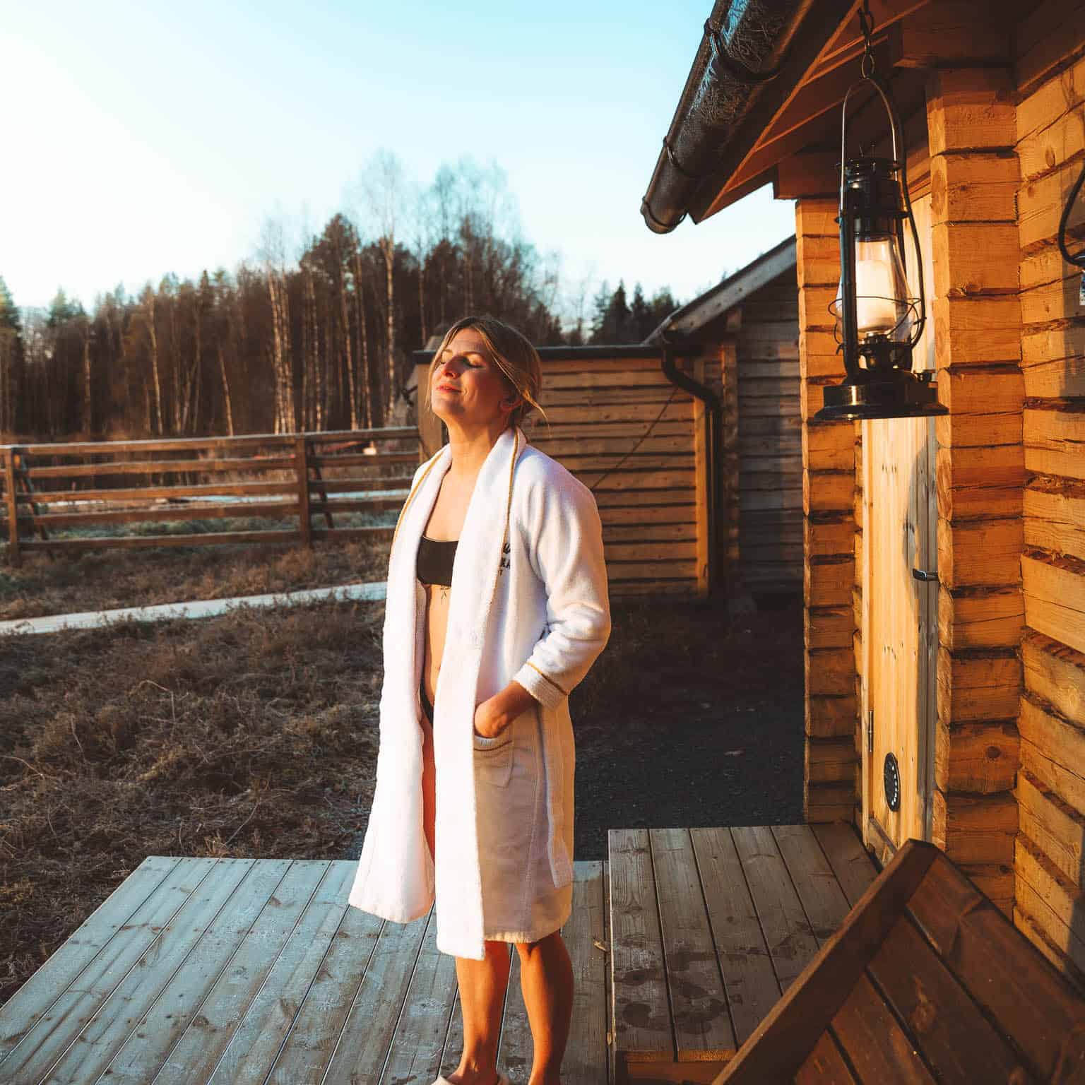 A guest relaxing at lakeside sauna
