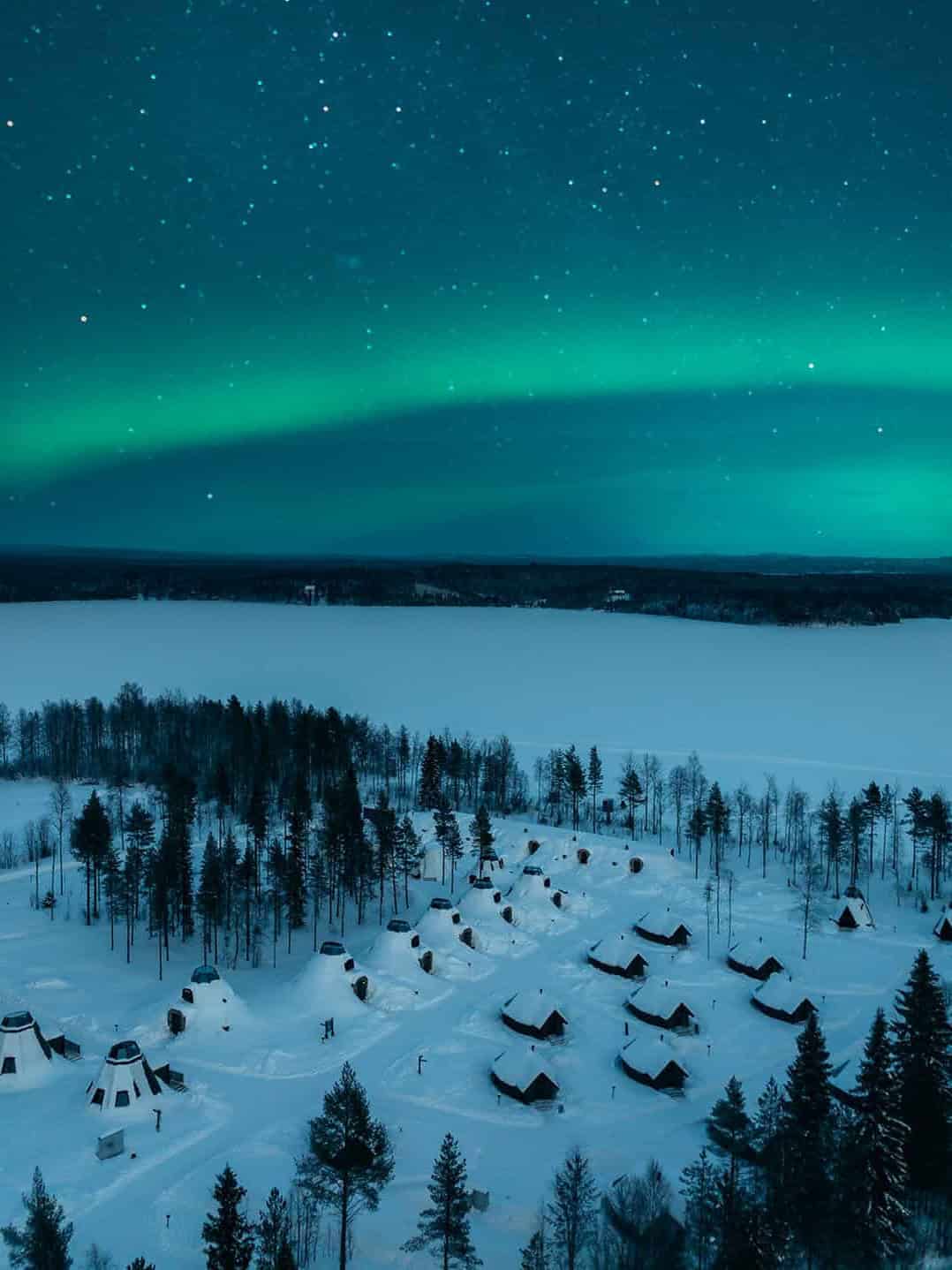 Aurora Borealis over Apukka Resort Rovaniemi aerial Lapland Finland New Year holiday