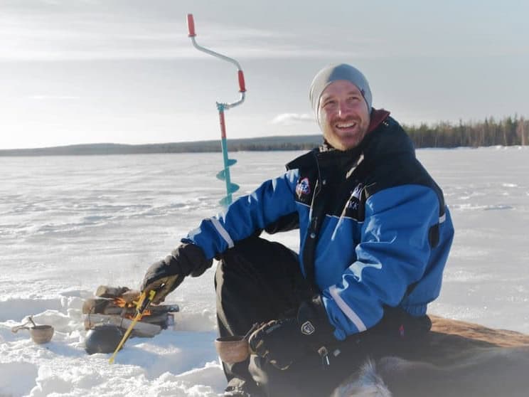 Ice fishing in march apukka resort rovaniemi lapland finland