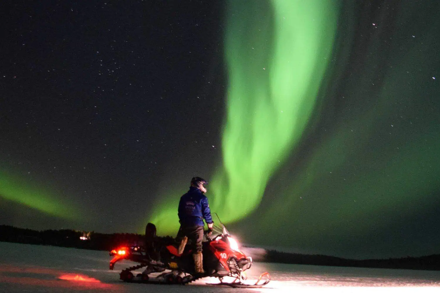Aurora hunting tour by snowmobiles in Apukka Resort Rovaniemi Lapland Finland