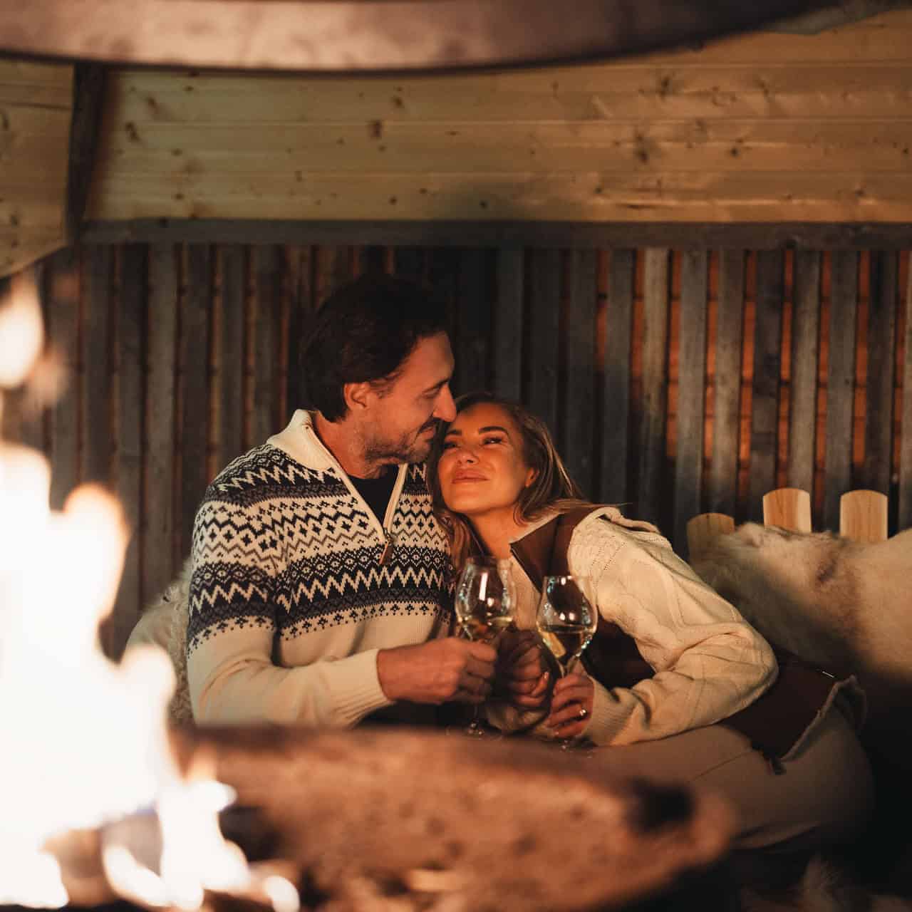 couple by the fire Proposal Package apukka resort rovaniemi lapland finland