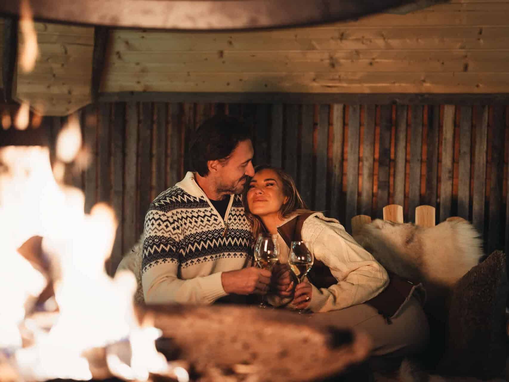 couple by the fire Proposal Package apukka resort rovaniemi lapland finland